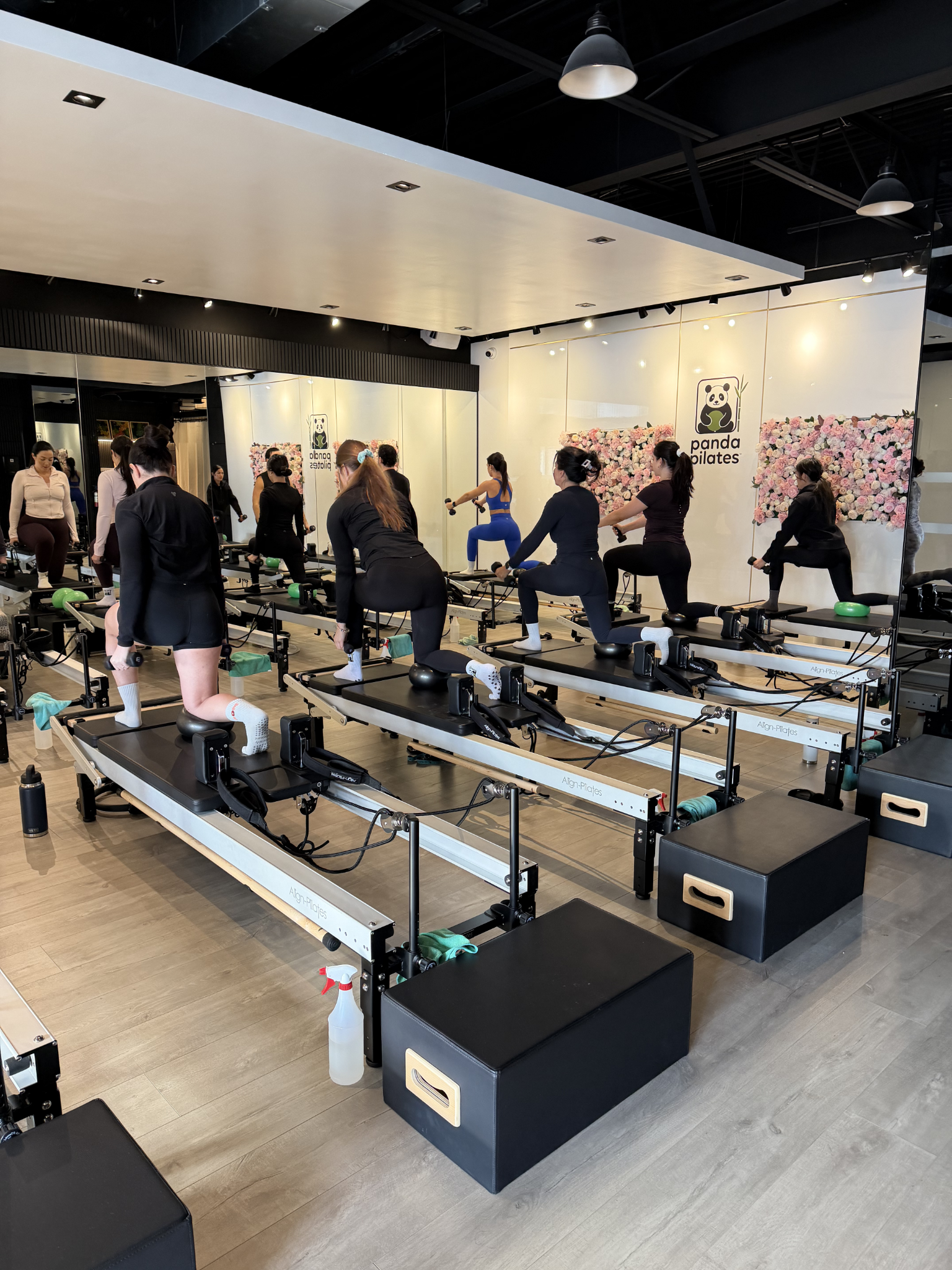Women taking a Reformer Pilates class at Panda Pilates
