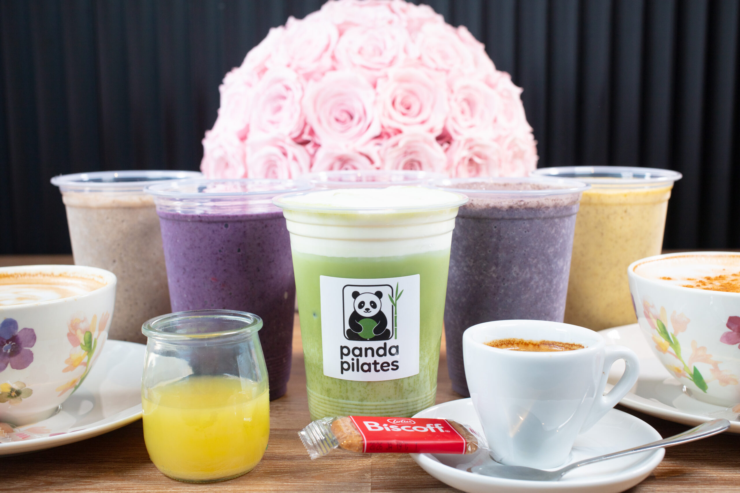 Panda Pilates matcha latte with protein shakes, smoothies and coffees in floral cups